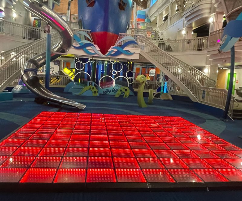 Illuminated dance floor and play area at a corporate event in the DMV area.