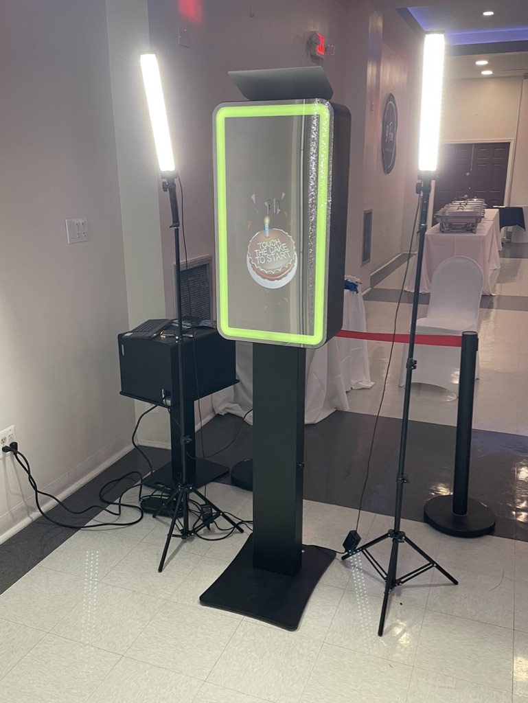 Mirror Air Photobooth with LED lighting for event entertainment and interactive guest experiences.