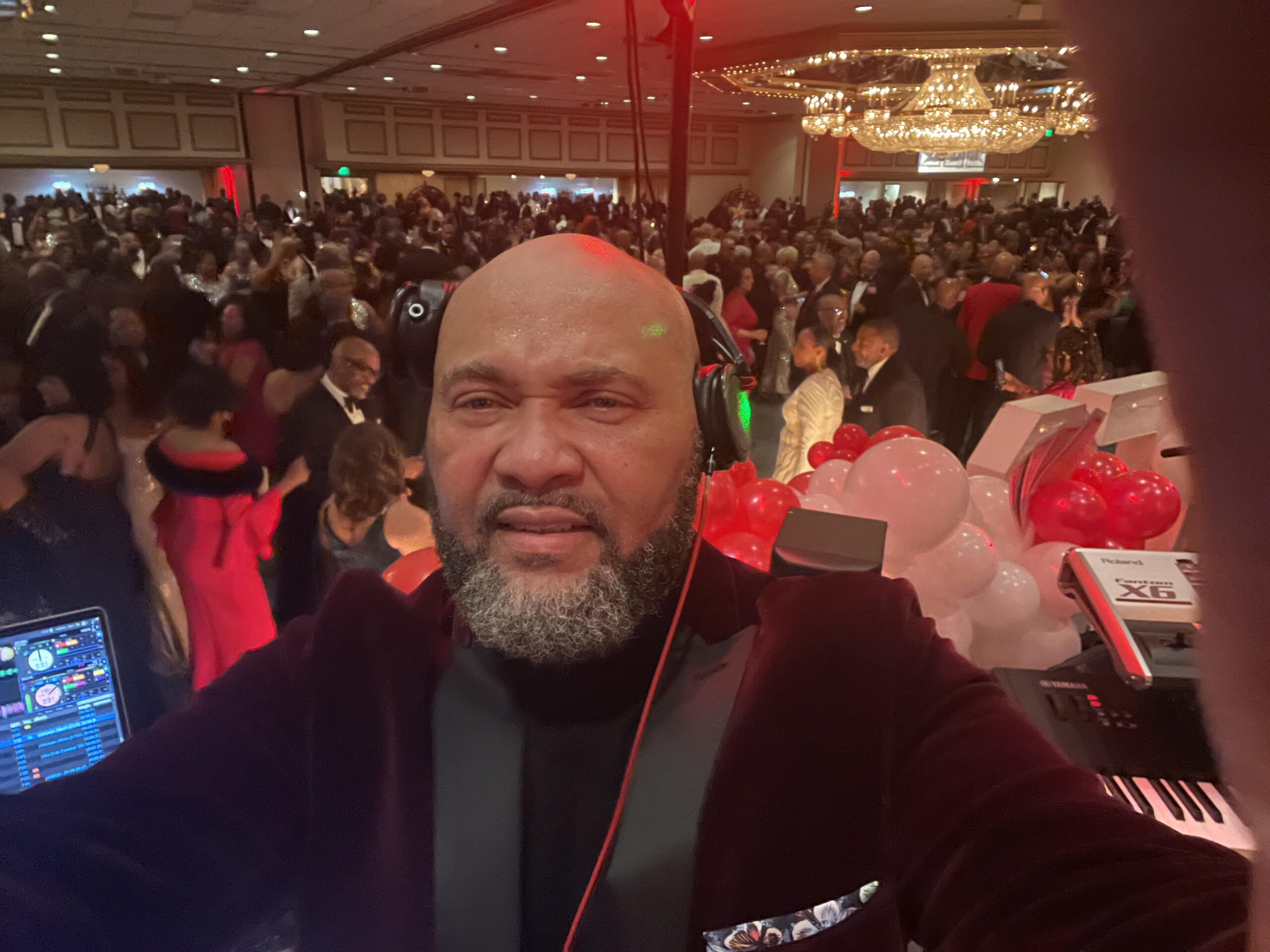 DJ curating a customized playlist for a vibrant corporate event, highlighting the importance of music selection